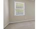Bright bedroom with a window offering natural light and neutral carpet at 125 Legacy Way, Oxford, GA 30054