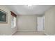 Bedroom featuring neutral walls, neutral carpet, and a window with decor at 125 Legacy Way, Oxford, GA 30054