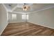 Spacious bedroom with wood floors, trey ceiling, and natural light at 125 Legacy Way, Oxford, GA 30054