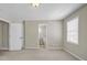 Bedroom with carpet and a view into an ensuite bathroom at 125 Legacy Way, Oxford, GA 30054