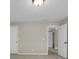 Bedroom showcasing neutral walls and carpet, along with an open doorway at 125 Legacy Way, Oxford, GA 30054