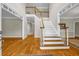 Welcoming foyer with hardwood flooring and staircase leading to the second floor at 125 Legacy Way, Oxford, GA 30054