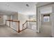 Upstairs hallway with railing and view into a bedroom at 125 Legacy Way, Oxford, GA 30054
