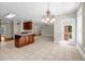 Open kitchen featuring an island with wood trim and tile flooring at 125 Legacy Way, Oxford, GA 30054