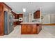Kitchen with stainless steel appliances, granite countertops, and wood cabinets at 125 Legacy Way, Oxford, GA 30054