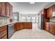 Open kitchen featuring an island, stainless appliances, and wood cabinets at 125 Legacy Way, Oxford, GA 30054