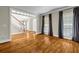 Inviting living room with hardwood floors, natural light, and staircase access at 125 Legacy Way, Oxford, GA 30054