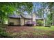 View of the backyard featuring a deck with painted purple railings at 273 Apalachee Church Rd, Auburn, GA 30011
