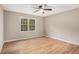 Bedroom with laminate flooring, neutral walls and a window with a green outdoor view at 273 Apalachee Church Rd, Auburn, GA 30011
