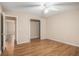 Spacious bedroom with wood floors and multiple doorways provides easy access to other rooms at 273 Apalachee Church Rd, Auburn, GA 30011