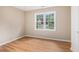 Bright bedroom with laminate flooring and double windows overlooking the front yard at 273 Apalachee Church Rd, Auburn, GA 30011