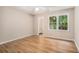 Bright bedroom with wood floors, large window, and ceiling fan offers a relaxing retreat at 273 Apalachee Church Rd, Auburn, GA 30011