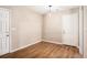 Bright entryway with wood floors, white doors, neutral walls, and stylish light fixture welcomes you home at 273 Apalachee Church Rd, Auburn, GA 30011