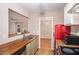 Kitchen showcases wooden countertops and a pass-through to an adjacent room, enhancing connectivity at 273 Apalachee Church Rd, Auburn, GA 30011