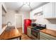 Updated kitchen with butcher block counters, stainless steel appliances, and a retro-style refrigerator at 273 Apalachee Church Rd, Auburn, GA 30011