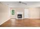 Clean, well-lit, and simple living room with wood-look flooring and fireplace at 273 Apalachee Church Rd, Auburn, GA 30011