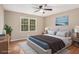Bedroom with large window and wood-look flooring at 273 Apalachee Church Rd, Auburn, GA 30011