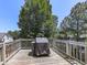 Backyard wooden deck provides a serene outdoor space, perfect for relaxing and entertaining at 504 Hillcrest Cross Rd, Canton, GA 30115