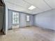 Unfinished basement area with natural light from a window, offering potential for customization at 504 Hillcrest Cross Rd, Canton, GA 30115
