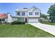 Two-story home with attached garage, well-kept lawn, and traditional architectural details at 504 Hillcrest Cross Rd, Canton, GA 30115