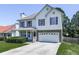 Two-story home with attached garage, well-kept lawn, and traditional architectural details at 504 Hillcrest Cross Rd, Canton, GA 30115
