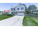 Two-story home with attached garage, well-kept lawn, and traditional architectural details at 504 Hillcrest Cross Rd, Canton, GA 30115