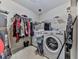 Functional laundry room featuring a modern washer and dryer, plus overhead storage racks at 504 Hillcrest Cross Rd, Canton, GA 30115