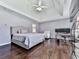 Large main bedroom showcasing hardwood floors, a tray ceiling, and a dedicated office space at 504 Hillcrest Cross Rd, Canton, GA 30115