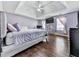 Spacious main bedroom with stylish hardwood floors, tray ceiling, and abundant natural light at 504 Hillcrest Cross Rd, Canton, GA 30115