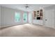 Spacious bedroom with built-in shelving and ample natural light at 5145 Saddlebred Ln, Cumming, GA 30028