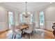 Dining room with hardwood floors, chandelier and natural light at 5145 Saddlebred Ln, Cumming, GA 30028