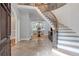 Grand foyer showcasing a curved staircase and open floor plan at 5145 Saddlebred Ln, Cumming, GA 30028