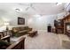 Cozy living room featuring plush seating, a fireplace, and neutral carpet at 5145 Saddlebred Ln, Cumming, GA 30028