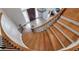 Grand staircase with wood treads and iron railing leads to the upper level at 5145 Saddlebred Ln, Cumming, GA 30028