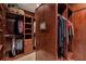 Spacious walk-in closet with wood shelving provides ample storage at 5145 Saddlebred Ln, Cumming, GA 30028