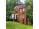 Charming brick two-story home with well-manicured lawn and mature landscaping at 6868 Wynbrooke Cv, Stone Mountain, GA 30087