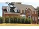 Classic brick home with dormer windows and covered front entry at 6868 Wynbrooke Cv, Stone Mountain, GA 30087