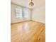 Light-filled bedroom with hardwood floors and minimalist decor for a serene atmosphere at 2230 Peachtree Road Nw Rd # A4, Atlanta, GA 30309