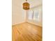 Sunlit bedroom showcasing hardwood floors and ample natural light through windows at 2230 Peachtree Road Nw Rd # A4, Atlanta, GA 30309