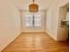 Bright dining room with hardwood floors and stylish lighting fixture at 2230 Peachtree Road Nw Rd # A4, Atlanta, GA 30309
