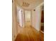 Hallway with hardwood floors leading to multiple rooms, including a tiled bathroom at 2230 Peachtree Road Nw Rd # A4, Atlanta, GA 30309