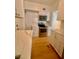 Modern kitchen with stainless steel appliances, white cabinets, and contrasting countertops at 2230 Peachtree Road Nw Rd # A4, Atlanta, GA 30309