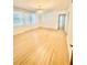 Bright living room featuring hardwood floors and neutral walls illuminated by stylish lighting at 2230 Peachtree Road Nw Rd # A4, Atlanta, GA 30309
