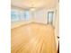 Bright living room featuring beautiful hardwood floors and large windows for natural light at 2230 Peachtree Road Nw Rd # A4, Atlanta, GA 30309