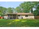 Large backyard with well-kept lawn and enclosed patio at 2405 Ingram Rd, Duluth, GA 30096