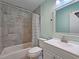 Clean bathroom with gray tiled shower and new white vanity at 2405 Ingram Rd, Duluth, GA 30096
