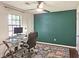 Study featuring a modern computer and a ceiling fan with attached light fixture at 2405 Ingram Rd, Duluth, GA 30096
