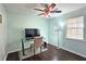 Bedroom with a modern ceiling fan and a large window for lots of natural light at 2405 Ingram Rd, Duluth, GA 30096