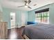 Tranquil bedroom with hardwood floors, ample closet space, and a view of the outdoors at 2405 Ingram Rd, Duluth, GA 30096