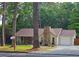 Charming single-story home with a stone chimney and lovely curb appeal at 2405 Ingram Rd, Duluth, GA 30096